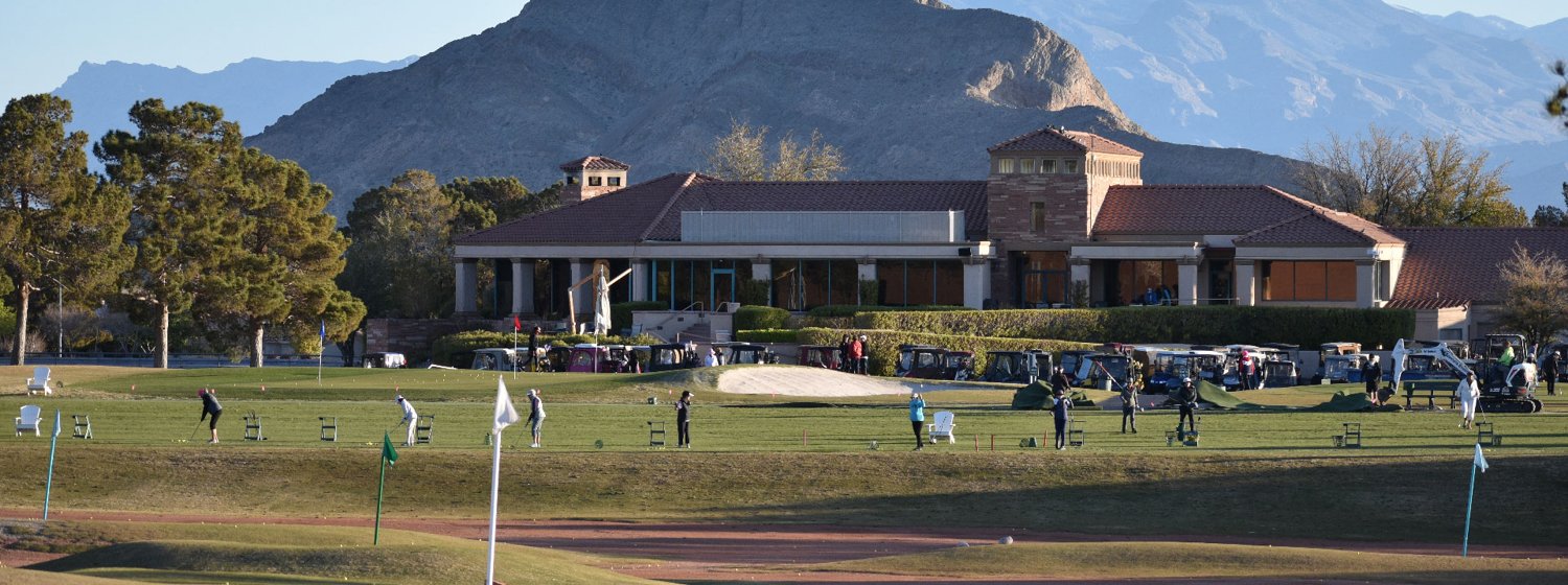 Golfers practicing on the driving range